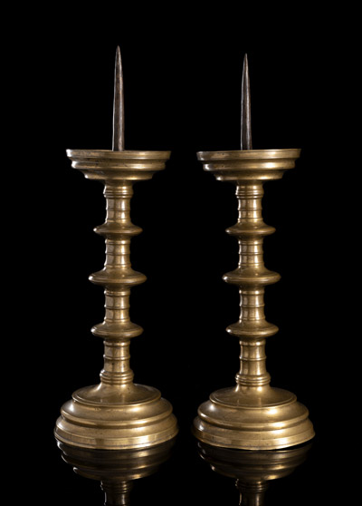 <b>A PAIR OF LATE GOTHIC BRASS CANDLESTICKS</b>
