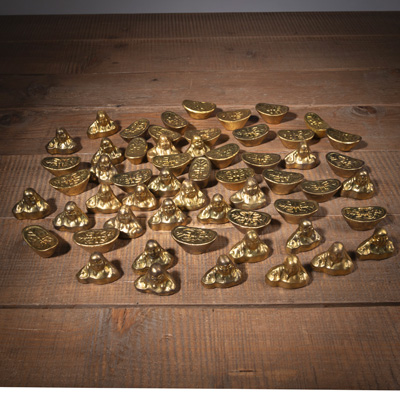 <b>A GROUP OF BUDAI- AND INGOT-SHAPED GILT WEIGHTS</b>