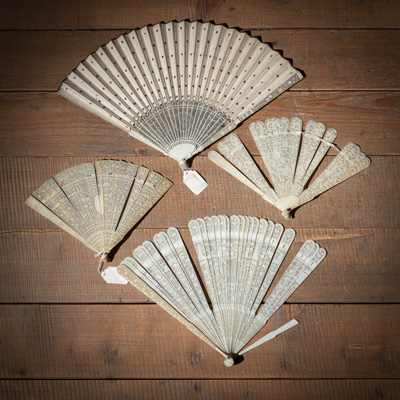 <b>FOUR CARVED AND OPENWORKED IVORY FANS, ONE PAINTED ON PAPER</b>