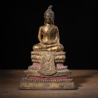 <b>GILT-BRONZE FIGURE OF BUDDHA ON A PEDESTAL</b>