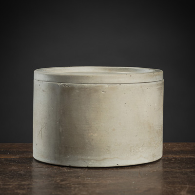 <b>A CYLINDRICAL UNGLAZED CLAY BOX AND COVER</b>