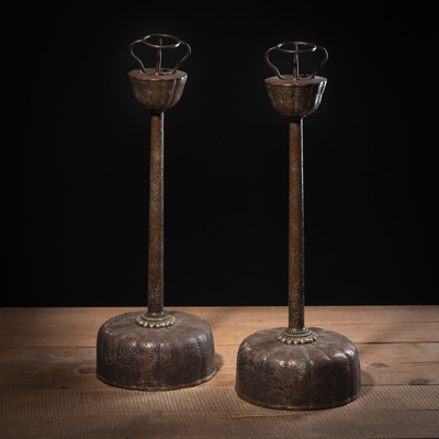 <b>A PAIR OF COPPER FLORAL RELIEF CANDLESTICKS</b>