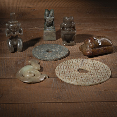 <b>A group of seven jades in archaic style, including bi-discs and zoomorphic figures</b>