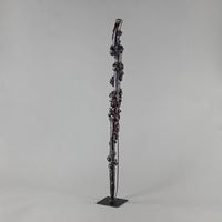 <b>A GNARLED ROOTWOOD STAFF WITH HORN TIP ON A METAL STAND</b>