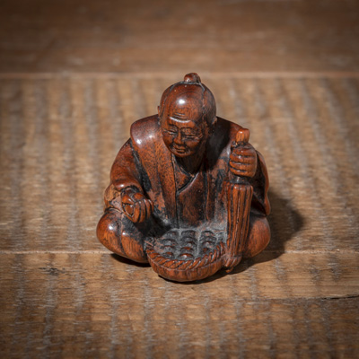 <b>Netsuke eines Eiverkäufers aus Holz</b>
