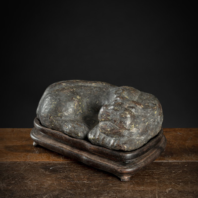 <b>A STONE FIGURE OF A RECUMBENT FELINE</b>