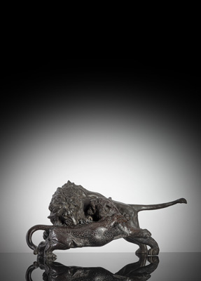 <b>A LARGE BRONZE OKIMONO OF A LION AND LEOPARD FIGHTING</b>