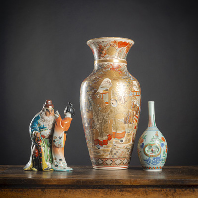 <b>A SATSUMA STONEWARE VASE WITH FIGURAL SCENES, A SMALL BOTTLE VASE IN NABESHIMA STYLE AND A PORCELAIN FIGURE OF SHOKI WITH A GEISHA</b>