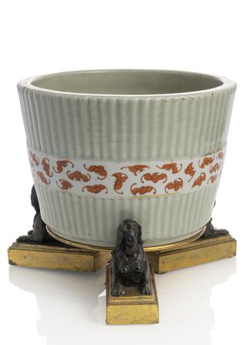 <b>A CELADON-GLAZED PORCELAIN JARDINIÈRE WITH A DECORATED BAND OF FLYING BATS MOUNTED ON A FRENCH PART-GILT EMPIRE STAND</b> <b>A CELADON-GLAZED PORCELAIN JARDINIÈRE WITH A DECORATED BAND OF FLYING BATS MOUNTED ON A FRENCH PART-GILT EMPIRE STAND</b>
