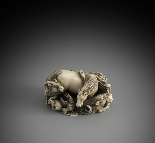 <b>A fine carved ivory netsuke of a Zodiac</b>