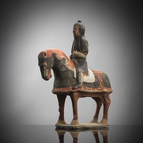 <b>A PAINTED POTTERY FIGURE OF AN ARMORED HORSE WITH RIDER</b> <b>A PAINTED POTTERY FIGURE OF AN ARMORED HORSE WITH RIDER</b>