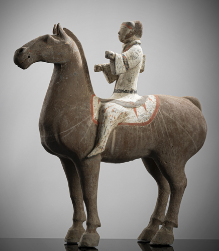<b>A PAINTED POTTERY FIGURE OF A HORSE AND RIDER</b> <b>A PAINTED POTTERY FIGURE OF A HORSE AND RIDER</b>