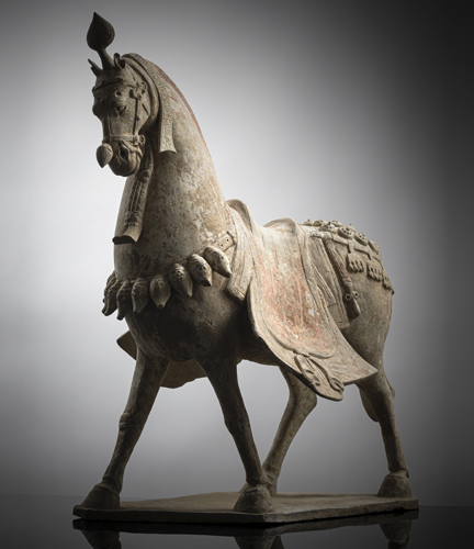 <b>A FINE LARGE POTTERY FIGURE OF A STRIDING CAPARISONED HORSE</b> <b>A FINE LARGE POTTERY FIGURE OF A STRIDING CAPARISONED HORSE</b>
