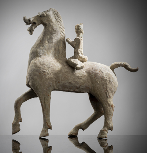 <b>A POTTERY FIGURE OF A STRIDING HORSE WITH RIDER</b> <b>A POTTERY FIGURE OF A STRIDING HORSE WITH RIDER</b>