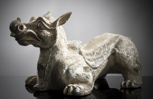<b>A POTTERY MYTHICAL BEAST STAND WITH RESIDUE OF PAINTING</b>