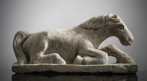 <b>A CARVED STONE FIGURE OF A RECUMBENT HORSE</b> <b>A CARVED STONE FIGURE OF A RECUMBENT HORSE</b>
