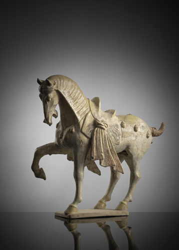<b>A POTTERY FIGURE OF A PRANCING CAPARISONED HORSE</b> <b>A POTTERY FIGURE OF A PRANCING CAPARISONED HORSE</b>