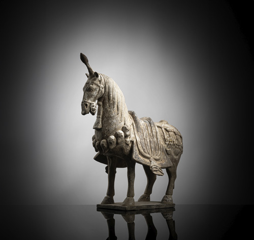 <b>A POTTERY MODEL OF A STANDING CAPARISONED HORSE</b>
