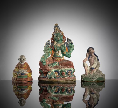 <b>A group of three polychorme painted pape machée figures of the green Tara, Milarepa and Zanabazar (?)</b>