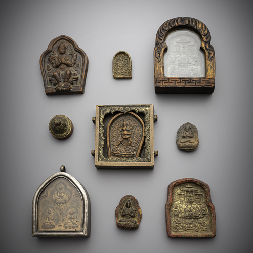 <b>A group of three gau with tsha tsha and seven tsha tsha, one gilded</b>