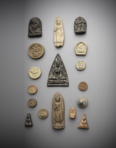 <b>A group of 17 tsha tsha, 3 of which are carved in stone, one in bronze</b>