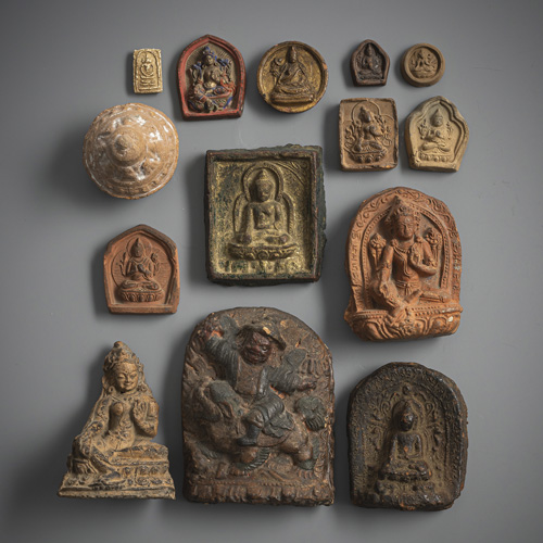 <b>Fourteen tsha tsha made of clay and earthenware, partly glazed or gilded or coloured</b>