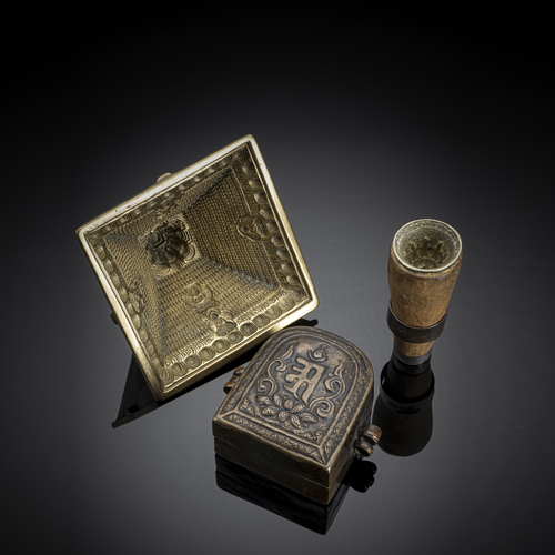 <b>Two bronze tsha tsha forms, one with a wooden handle and copper gau</b>