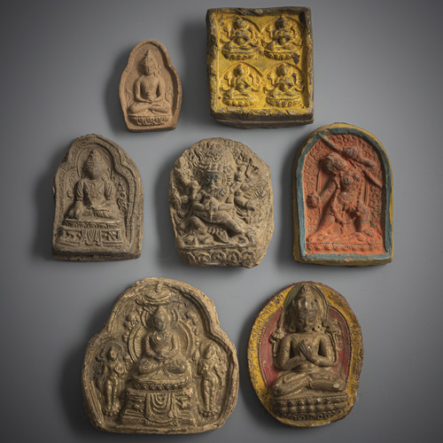 <b>Seven tsha tsha made of earthenware, partly glazed or gilded or coloured</b>