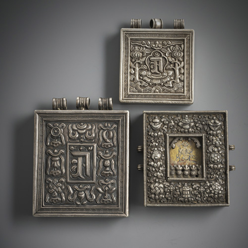 <b>Three gau or amulet boxes, one with tsakli, partly worked in silver</b>
