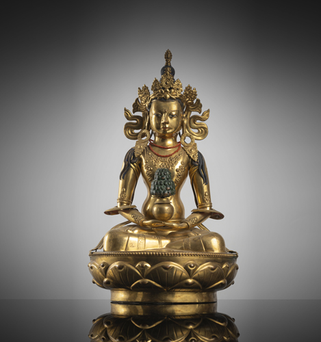 <b>A gilt-copper repoussé figure of Amitayus on a lotus</b>