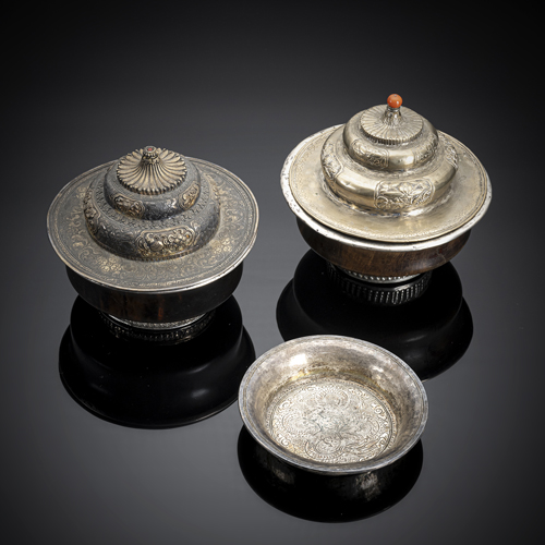 <b>A silver bowl and cover and two wooden bowls, partly with silver and a silver bowl</b>