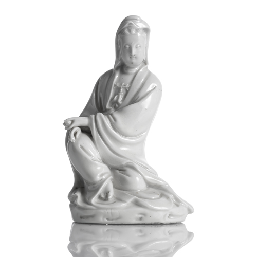 <b>A Dehua model of seated Guanyin with scroll</b>