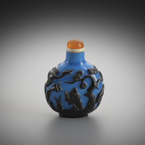 <b>A bright blue glass snuff bottle with black-blue overlay of Hehe Erxian and Sage near pnies and crane</b> <b>A bright blue glass snuff bottle with black-blue overlay of Hehe Erxian and Sage near pnies and crane</b>