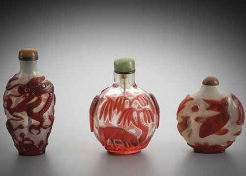 <b>Three glass snuff bottles with red overlay of dragons, fish or a horse under a willow tree</b> <b>Three glass snuff bottles with red overlay of dragons, fish or a horse under a willow tree</b>
