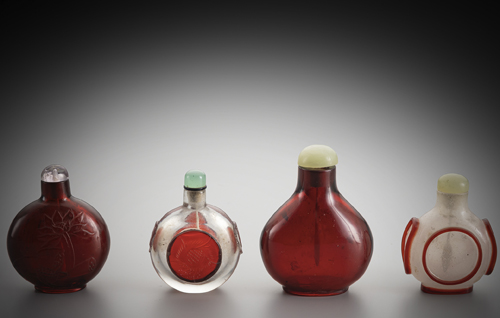 <b>A group of four glass snuff bottles: two ruby red bottles and two bottles made of transparent or milky white glass</b> <b>A group of four glass snuff bottles: two ruby red bottles and two bottles made of transparent or milky white glass</b>