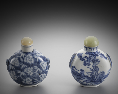 <b>Two porcelain snuff bottles decorated in underglaze blue with flowers or monkeys in a landscape</b> <b>Two porcelain snuff bottles decorated in underglaze blue with flowers or monkeys in a landscape</b>