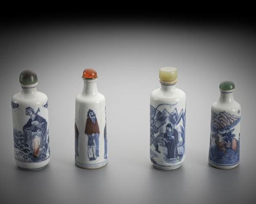 <b>Four porcelain snuff bottles decorated in copper red and underglaze blue</b> <b>Four porcelain snuff bottles decorated in copper red and underglaze blue</b>