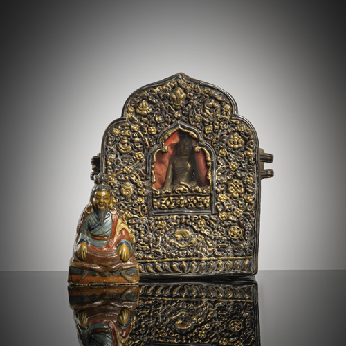 <b>A PARCEL METAL AMULET-BOX, GAHU AND A PAINTED PAPIERMACHE FIGURE OF A MAHASIDDHA</b>