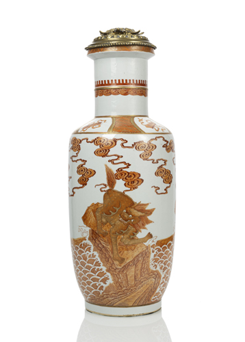 <b>A PORCELAIN ROULEAU VASE DEPICTING TWO MYTHICAL CREATURES STANDING ON ROCKS ABOVE WAVES IN IRON RED AND GOLD PAINTING</b> <b>A PORCELAIN ROULEAU VASE DEPICTING TWO MYTHICAL CREATURES STANDING ON ROCKS ABOVE WAVES IN IRON RED AND GOLD PAINTING</b>