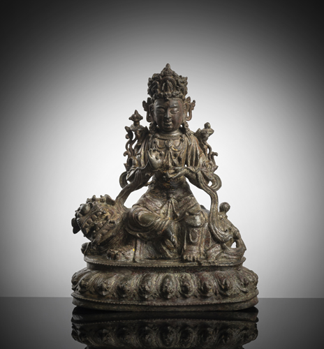 <b>A BRONZE FIGURE OF GUANYIN ON A LION</b>