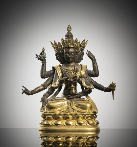<b>A PARCEL GILT-BRONZE FIGURE OF USHNISHAVIJAYA</b>