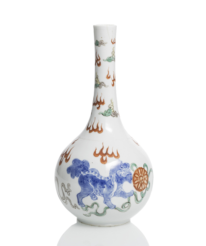 <b>A porcelain bottle vase with Buddhist lions in underglaze blue with polychrome enamel decoration</b> <b>A porcelain bottle vase with Buddhist lions in underglaze blue with polychrome enamel decoration</b>