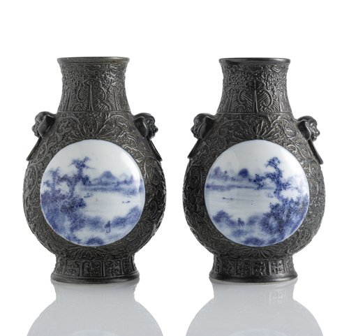 <b>A pair of porcelain vases, imitating metal, with underglaze blue medallions</b> <b>A pair of porcelain vases, imitating metal, with underglaze blue medallions</b>