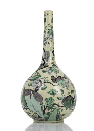 <b>A bottle vase with decoration of squirrels and grapes in the colours of the 'Famille jaune'</b> <b>A bottle vase with decoration of squirrels and grapes in the colours of the 'Famille jaune'</b>