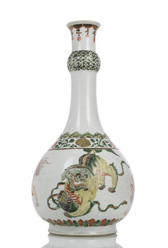 <b>A 'Wucai' bottle vase with four Buddhist lions and brocade balls</b> <b>A 'Wucai' bottle vase with four Buddhist lions and brocade balls</b>