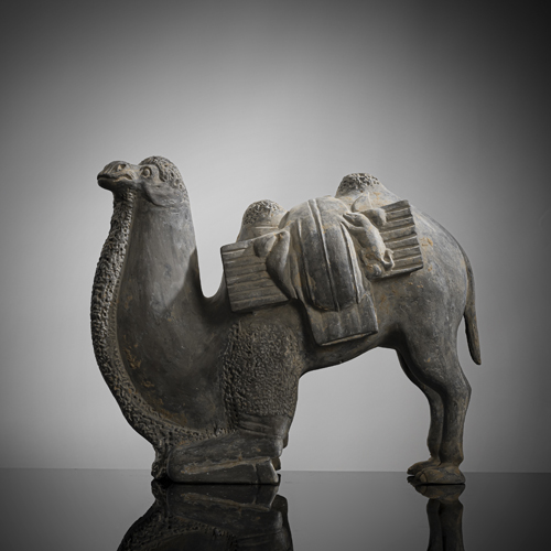 <b>A GREY POTTERY FIGURE OF A KNEELING CAMEL</b> <b>A GREY POTTERY FIGURE OF A KNEELING CAMEL</b>