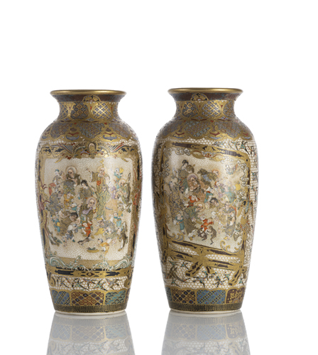 <b>A fine pair  of Satsuma vases with decoration of fish between waves, scenes with Buddhist figures and the finest lattice pattern</b>