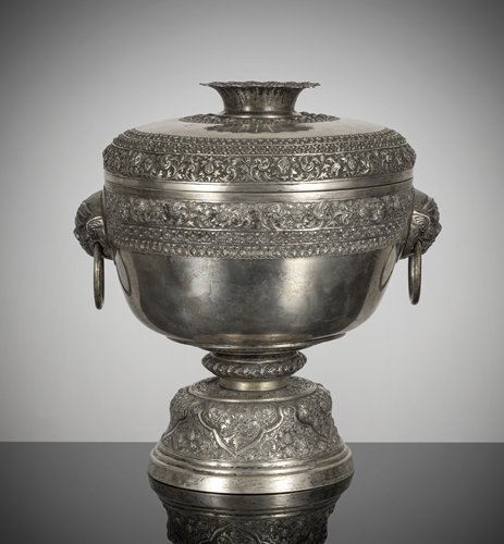 <b>A large silver stemcup and cover with fine relief decoration and lion's head handles</b>