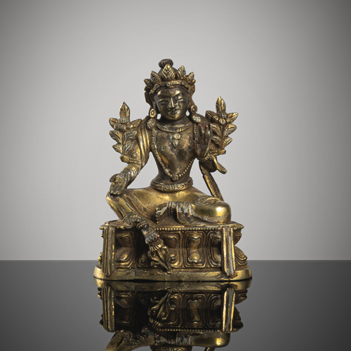 <b>A small gilt-bronze of the Syamatara on a lotus</b>