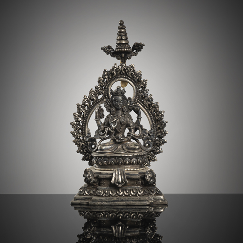 <b>A fine silver figure of Vasudhara on a throne</b>